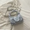 Bolso pequeño lindo de estilo coreano para mujer, nuevo bolso de hombro con cadena de moda 2026, bolso nube versátil de color liso simple