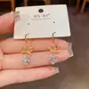 Moda Japonesa Coreana Luxo Leve Laço de Pérola Zircônia Coração Gancho de Orelha Individual Versátil Toque de Alto Padrão Emagrecimento Brilhante Super Pendentes de Orelha