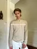 Camiseta Masculina Eme de Lã Australiana com Gola Henley Cor Sólida Manga Longa Ajustada Outono/Inverno 2025 Novidade Tricô
