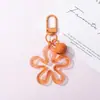 Llavero con hebilla de flor hueca transparente fresca y colorida, accesorio de campana, colgante para bolso, venta al por mayor