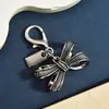 Llavero de Plata Vintage con Lazo y Textura, Accesorio Versátil para Bolso, Accesorio de Moda para Viajes Diarios, Arte con Cuentas DIY