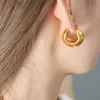 Brincos geométricos de titânio e aço banhados a ouro, de alta qualidade, luxo leve, nicho, design europeu e americano, transfronteiriços, joias versáteis para mulheres