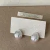 Pendientes Metálicos de Zirconia Estilo Ráfaga de Estrella Cepillados Tipo Frijol de Lujo Ligero y de Gama Alta para Mujer Moda Elegante de Nicho Pendientes de Moda