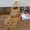 Bolso tejido para mujer, nuevo modelo de verano 2026, nicho y súper popular, bolso de hombro para el trabajo, bolso cruzado con borlas, bolso de playa de paja