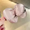 Pinza para el pelo de satén con lazo y relleno de algodón Dongdaemun coreana para coleta, accesorio para el pelo tipo pinza banana hacia abajo para mujer
