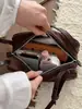 Bolsa de Bolos de Mano para Mujer 2026 Nuevo Otoño Invierno Súper Caliente Color Sólido Tacto de Alta Gama Hombro Único Bolso Baguette para Viaje