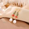 Yilu prata S925 prata de lei banhado a ouro pérola de água doce moda nacional cloisonné Xiangyun Camélia brincos estilo étnico gancho de orelha