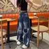 Jeans de mujer de estilo americano con estampado de grafiti rasgado y dobladillo curvo, estilo fino de verano, nuevo diseño 2026, pantalones de pierna ancha de cintura alta