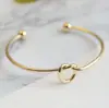 Pulsera de nudo de amor de acero de titanio transfronteriza, pulsera abierta con forma de corazón C, pulsera de brazalete con nudo, tendencia