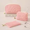 La nueva bolsa de maquillaje de la serie lisa de Runhui es ultraligera y portátil, un juego de tres bolsas de maquillaje de malla para venta al por mayor