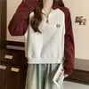 Foto Real de Amazon de Sudadera de Color Contrastante de Manga Larga para Mujer, Estilo Coreano de Principios de Otoño, Holgada, Cuello Polo con Media Cremallera, Top Delgado