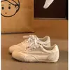 Zapatillas de entrenamiento alemanas de suela plana para mujer, nuevo modelo primavera-verano 2026, zapatillas casual populares, zapatillas blancas versátiles
