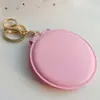 Espejo de Maquillaje Color Caramelo Estilo Coreano Espejo Redondo Pequeño de Cuero Espejo de Maquillaje Plegable Portátil Llavero Espejo de Doble Cara Colgante de Bola de Pelo