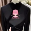 Ropa interior térmica para niñas Otoño/Invierno 2026 Nuevo estilo Terciopelo alemán Top de manga larga con volantes y cuello alto para niños de mediana y mayor edad