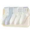 Calcetines blancos y azules con lazo para mujer, calcetines de media pantorrilla, estilo coreano de moda para primavera y otoño, estilo deportivo universitario, calcetines largos blancos para niñas