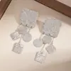Pendientes Metálicos Exagerados de Forma Irregular de Gota de Agua Europeos y Americanos para Mujer Pendiente de Flor de Ola de Industria Pesada de Nicho Accesorio de Concha de Pulpo Venta al por Mayor