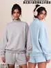 Conjunto de ropa europea y americana para mujer transfronterizo: sudadera casual y shorts, sudadera holgada de forro polar color liso, cuello medio alto, estilo 'dopamine hot girl'