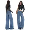 Jeans vintage de pierna ancha lavados con patrón de bambú azul para mujer, con un diseño único en la cintura trasera, bolsillos con solapa, detalles bordados y un corte de algodón hasta el suelo