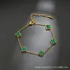 Pulseira de trevo de quatro folhas transfronteiriça, uma peça luxuosa e de alta qualidade, um design de nicho e minimalista, um acessório de joia popular para mulheres, em estilos europeu e americano
