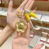 Llavero Dorado Oro Puro 999 Cadena para Teléfono Móvil Colgante con Bolsa para Gastar Dinero Colgante de Año Nuevo Regalos Pequeños Culturales y Creativos Mayoreo
