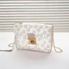 Bolsa Feminina de Guangzhou 2025 Nova Moda Bolsa Quadrada Pequena Transparente Decorada com Flores Bordadas Bolsa de Ombro Bolsa Carteiro de Grande Capacidade