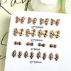 Joyería de uñas transfronteriza, lazo de dibujos animados con cinta de leopardo francesa tridimensional, joyería de uñas DIY al por mayor