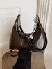 Bolso de hombro de color liso vintage para mujer, nuevo bolso de moda para debajo del brazo, bolso de mano para mujer 2026 nuevo bolso versátil de hombro y cruzado