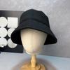 Venta al por mayor Corea del Sur nuevo sombrero de pescador retro desgastado visera para el sol circunferencia de cabeza grande cara pequeña sombrero de cuenca solar para mujer Wenling copa plana