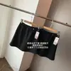 Falda Corta Suave y Amigable con la Piel de Línea A Anti-Exposición Botón Cintura Alta Falda de Lana Línea A Media Falda para Mujer 26 Invierno H100509