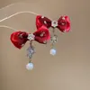 Aretes y Collar de Gota de Agua Incrustados con Diamantes Rojos de Año Nuevo, Accesorios Versátiles de Lujo Ligero de Nicho, Juego de Joyería de Alta Gama para Mujer al por Mayor
