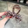Diseño elegante y simple, pinza para el cabello de cristal morado lujosa y exquisita para sujetar y peinar el cabello en la nuca.