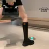 Otoño e invierno 2023 Botas finas de punta redonda Nuevas Botas altas negras de tacón grueso elásticas para mujer que estilizan la rodilla, combinan con todo