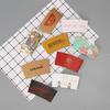 Papel Kraft Marrom Manga para Copo de Chá com Leite Cinto Isolante Descartável Ondulado Alça Especial em Formato de Café Manga para Copo de Café Logotipo Personalizado