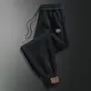Calças Masculinas Primavera e Outono Novas Calças Casuais para Todos os Jogos Estilo Coreano Calças Esportivas Masculinas Soltas Calças da Moda