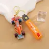 Mini Carro de Corrida de Borracha Macia Boneco Chaveiro de Carro Casal Pingente de Mochila Escolar Presente Pequeno Criativo Venda por Atacado
