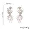 Aretes de Aguja de Plata con Flores Incrustadas de Diamantes y Borlas de Perlas, Lujo Ligero y Sensación de Alta Gama, Aretes de Moda y Elegantes con un Diseño Único