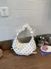 Bolso de lunares para mujer 2026 nuevo estilo verano exquisito bolso de un solo hombro gran capacidad para ir al trabajo bolso de axila bolso cruzado tipo bollo