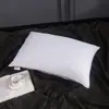 Almohada de terciopelo con plumas al por mayor de fábrica, almohada para el hogar, almohada blanca para hotel, almohada para el cuello individual, almohada para la salud
