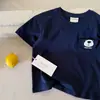 Camiseta de Verano de Manga Corta para Niños Estilo Nuevo 2026 Oso de Dibujos Animados para Bebé Cuello Redondo Camiseta Básica Top Casual para Niños Tendencia
