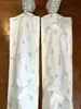 Pantalones vaqueros florales de nicho blancos, nuevo modelo otoño 2025, diseño de cintura alta, corte holgado, adelgazante, pierna recta, pantalones de algodón hasta el suelo