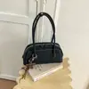 Bolsa tecida de PU retrô de alta qualidade para mulheres, novo estilo 2026, bolsa tote, grande capacidade, adequada para o dia a dia, bolsa de ombro e pode ser carregada sob o braço