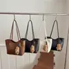 Bolsa tote de gran capacidad para mujer, nueva moda de otoño 2026, bolso de hombro de nicho de alta gama, bolsa para la oficina