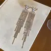 Pendientes minimalistas de plata con aguja, diamantes y borlas, que ofrecen un lujo ligero y una sensación de alta gama, elegantes y sencillos, versátiles y elegantes.