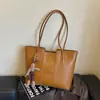 Bolsa Feminina Estilo Coreano 2026 Outono Nova Simples Retrô Bolsa de Ombro Único Textura Classe Trabalho Bolsa Tote de Axila