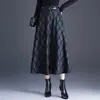 Moderna falda de cuadros línea A para mujer, nuevo estilo otoño e invierno 2026, elegante falda midi de cintura alta acampanada estilizada para mujer
