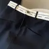 Falda negra de cintura alta con estampado de letras para mujer, estilo europeo de primavera y otoño, línea A, abertura trasera, longitud media, falda de traje de corte recto