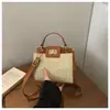 Bolsa de Mão/Ombro/Transversal Feminina Retro Tecida Cor Sólida 2026 Nova Moda Elegante com Fecho de Metal