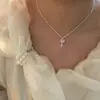 Luz colgante de corazón geométrico dulce rosa palo cadena de clavícula de circón de lujo versátil exquisita Saturno diseño de nicho collar