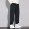 Calças casuais cinza de outono para homens, modelagem solta, com punho, calças de nove pontos, nova marca da moda 2026, calças esportivas estilo harém com retalhos