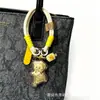 Colgante de Oro Puro con Concha de Agua Nuevo Oso Mantequilla Bolsa Dibujo Animado Lanyard de Moda Llavero Regalo de Año Nuevo Mayoreo